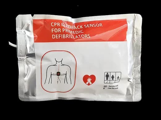 Defibrillation electrode pad with CPR feedback sensor